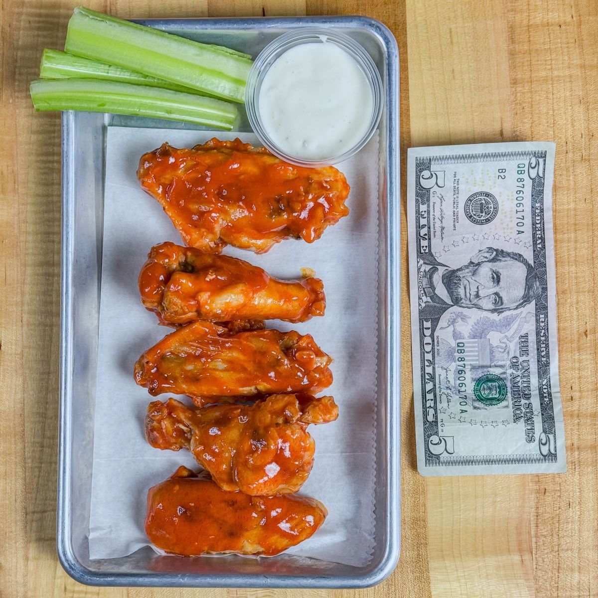 Plate of five chicken wings, Foundation's Thursday five-dollar wing special